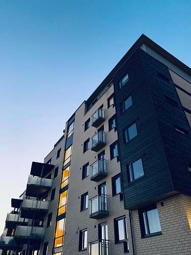 high rise low angle photo of high rise apartment building urban